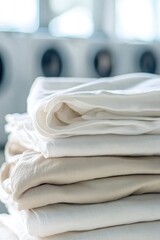 Neatly stacked linens in soft tones create serene, organized atm