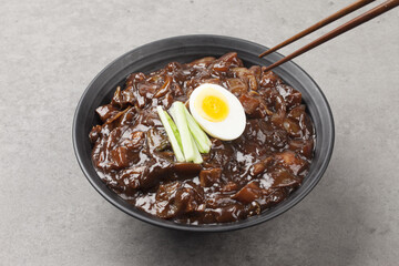 Jjajangmyeon is one of Chinese dishes. The noodles are mixed with Chinese soybean paste stir-fried with meat and vegetables.