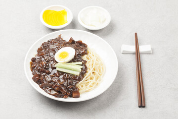 Jjajangmyeon is one of Chinese dishes. The noodles are mixed with Chinese soybean paste stir-fried with meat and vegetables.