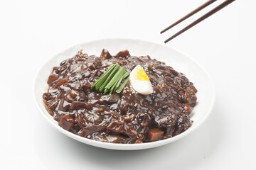 Jjajangmyeon is one of Chinese dishes. The noodles are mixed with Chinese soybean paste stir-fried with meat and vegetables.