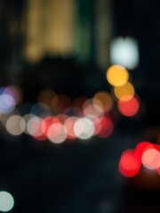 Mysterious Blurry Night Cityscape with Glowing Lights and Shadows Creating an Enigmatic Urban Atmosphere