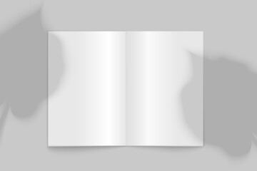 Vector mockup of open book with palm leaves shadows on a gray background. Template for design.
