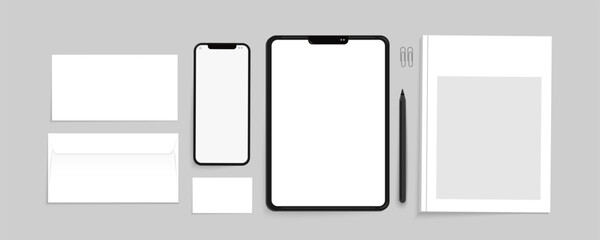 Set of mockups on gray background. Tablet, phone, envelopes, business card vector templates.