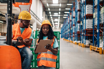 Warehouse workers managing inventory with forklift and clipboard