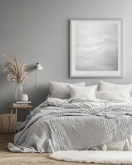 Serene bedroom with minimalist gray bedding, artwork, and pampas grass.