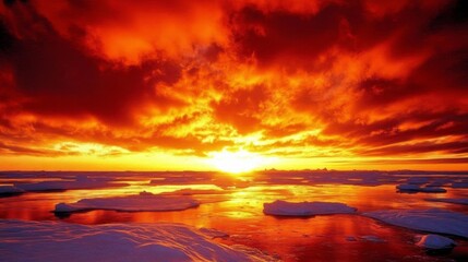 Fototapeta premium Fiery arctic sunset over icy landscape with reflective waters