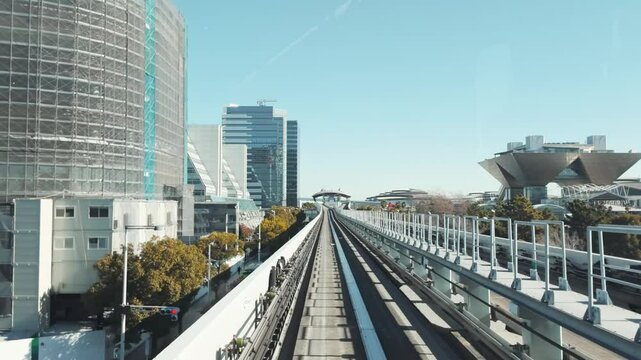 Tokyo, Japan - January 29, 2025 : Cityscape from Yurikamome monorail sky train in Odaiba, the artificial island in Tokyo, Japan