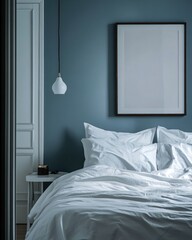 Serene bedroom with white bedding, teal walls, and a blank frame.