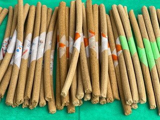 closeup of handmade  incense sticks for sale at a street market outdoors