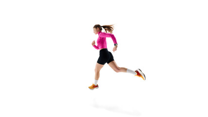 Side view dynamic image of young competitive woman, runner in motion, demonstrating agility, and focus against white studio background. Concept of athletics, sport, endurance, healthy lifestyle. Ad