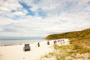 Fototapeta premium Beach with hooded beach chairs at Hiddensee island in the Baltic Sea, Germany