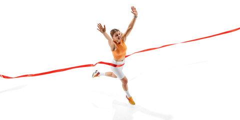 Victorious female sprinter leaping past finish line, arms raised in triumph, eyes focused, body expressing strength and dedication against white studio background. Concept of competition, success