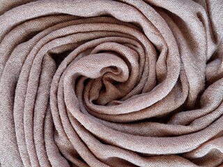 Fabric as background in Mocha mousse color of the year 2025 with earthy tone. Abstract wallpaper. Mocha Mousse tan texture abstract