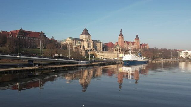 Szczecin Waterfront: Reflected Architecture and Ship on a Sunny Day. Chrobry Embankment, Haken Terrace.