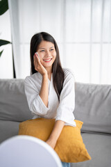 Daily beauty routine Asian woman.with clean skin uses micellar water to remove makeup