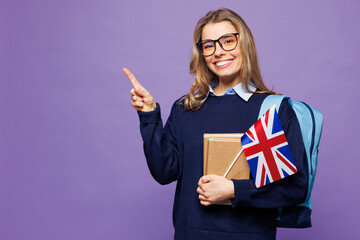 Young girl student wear blue casual clothes glasses backpack bag hold books British flag point...