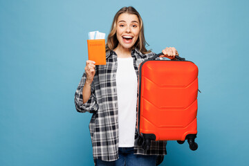 Traveler fun woman wear grey casual clothes hold passport ticket suitcase bag isolated on plain...