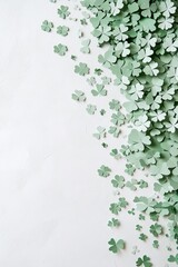 The design for a St Patrick's Day vertical banner includes a poster template, green paper cutouts of clover leaves, and confetti, all set against a white background