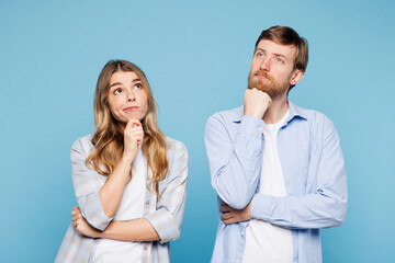 Young couple two friends family man woman wear shirt casual clothes together put hand prop up on...