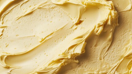 A close-up shot of yellow creamy butter spread. Cream texture. Pastry cream. Custard. Scalded cream