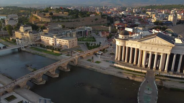 Drone view overlooking Skopje City Centre and Vardar Riverside at sunset - Macedonia