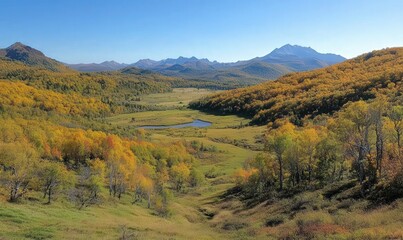 Autumn Valley Landscape with Golden Aspen Trees and Distant Mountains