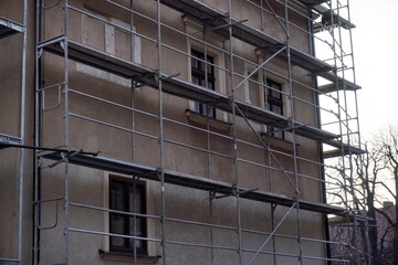 Scaffolding around the old building renovation facade