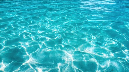 Obraz premium Crystal clear turquoise water surface with gentle ripples