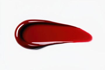 Glossy red liquid forms an elegant droplet, highlighting smooth