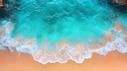 Ocean waves meeting sandy beach