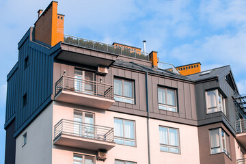 living building real estate object external facade frame walls and windows foreshortening from below cloudscape background