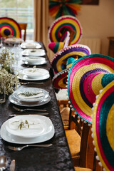 Festive table setting with colorful Mexican sombreros