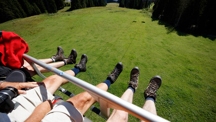 Exploring the Dolomites in Italy with breathtaking views from a chairlift ride high above lush...
