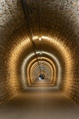Valeta cycling and pedestrian tunnel following the narrow gauge train track along inland cities of...