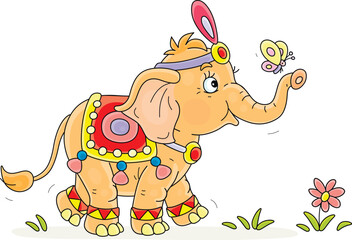 Little elephant with colorful festive decorations walking on green grass and playing with small butterfly fluttering around, vector cartoon illustration on a white background