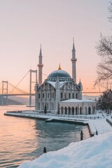 Naklejka premium Snowy mosque by a bridge at sunset.
