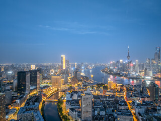 Aerial panoramic view of Shanghai skyline and Huangpu river at night
