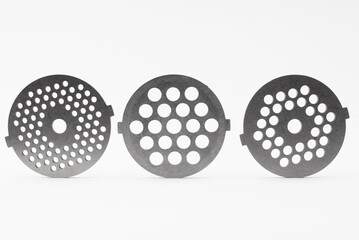 Set of Three Circular Metal Grinder Blades with Perforated Designs..