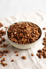 Homemade Healthy Chocolate Granola in a Bowl, side view.