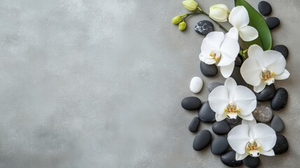 Mindfulness and meditation wellness concept: top view of spa or wellness design elements with orchid and pebbles elements on light grey background, flat lay with space for text.