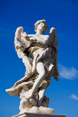 Fototapeta premium Angel with the Superscription by Gian Lorenzo Bernini and son Paolo on Ponte Sant'Angelo - Rome - Italy