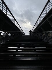 Fototapeta premium Man walking on a stairway to heaven in Paris.