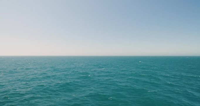 Wide floating ocean view from a moving ship, port side. For projects requiring longer clips in higher resolution, visit StockPlates.