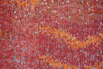 Red color mosaic wall pattern.