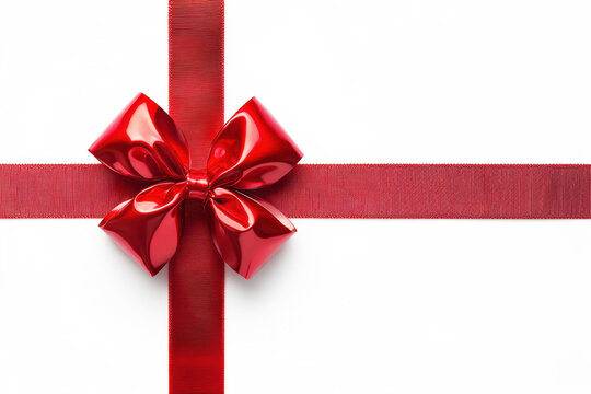 Stock photo of a red bow tied and crossed in the form of a gift wrap on a white background. The high-contrast composition ensures a striking visual impact, perfect for advertisements, packaging design