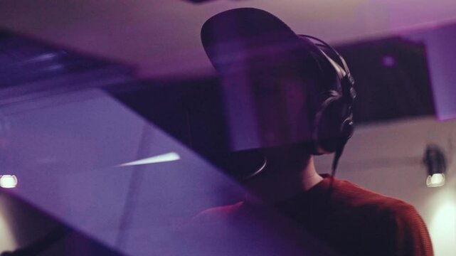 Music studio rapper making beats andf playing violin