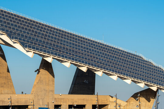Photovoltaic solar panels at Marina Port Forum under clear blue skies, representing eco-friendly urban development.