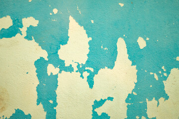 Weathered blue wall with peeling paint, grunge texture ideal for creative design and photography backdrops