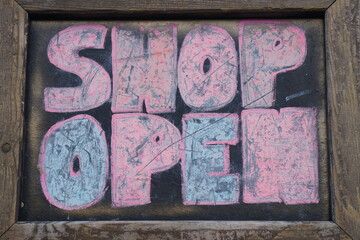 shop open insignia designed with colored chalk