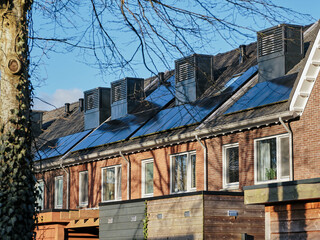 Modern row houses with integrated heat pumps on the roof in Assen